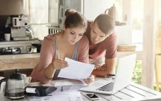 Australian couple reviewing end-of-life planning documents at home