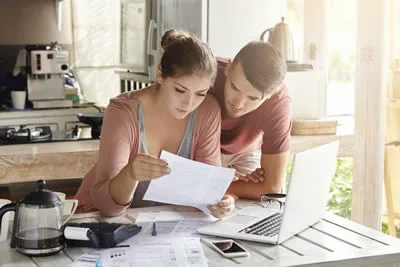 Australian couple reviewing end-of-life planning documents at home