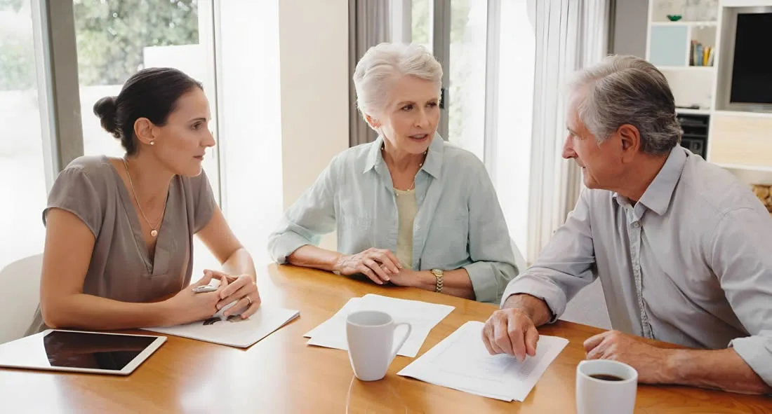 Family discussing dementia and end-of-life planning together at home