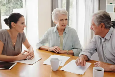 Family discussing dementia and end-of-life planning together at home