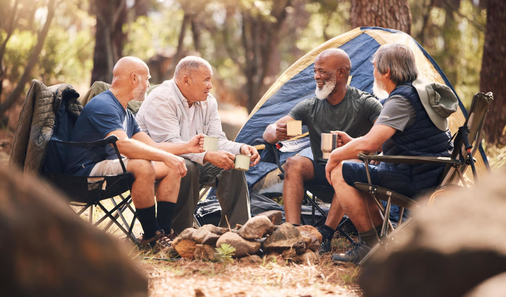 Group of men sitting together outdoors and talking