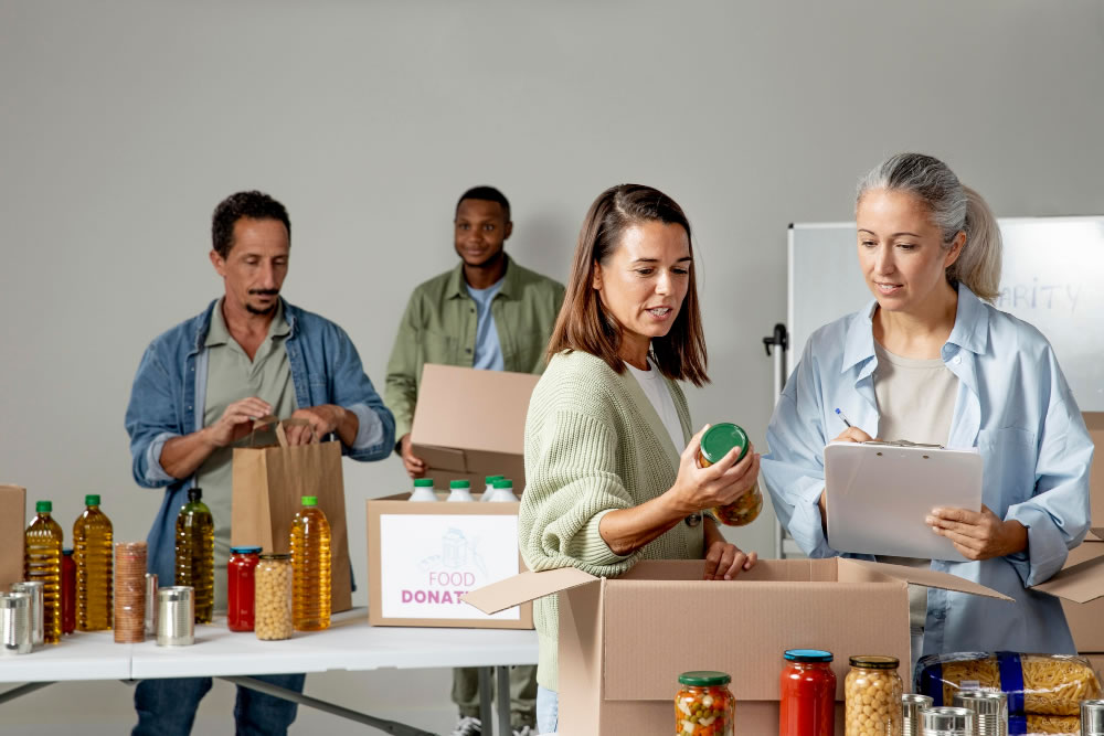 Volunteers sorting donated food and supplies together.