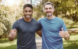 Two men of different ages promoting positive health habits and planning ahead during Men's Health Week.
