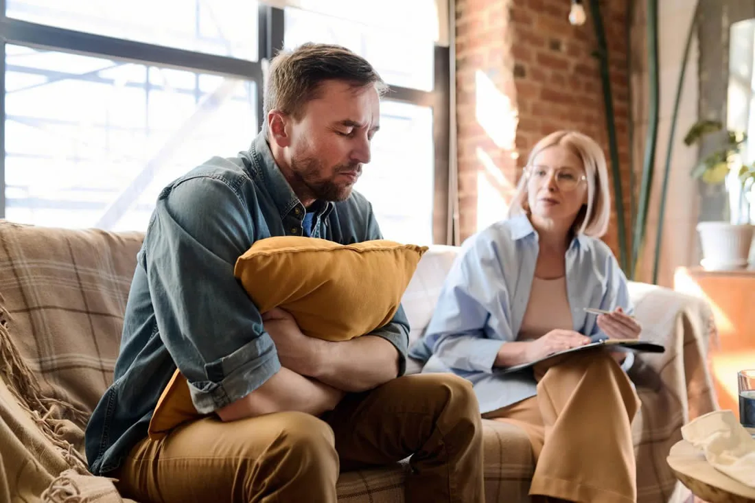 Person receiving professional grief support and counselling